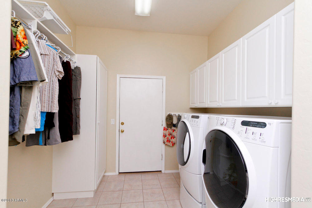 365 North Muleshoe Road Apache Junction, AZ 85119 - Photo 51 of 54 a view of walk in closet with clothes and shoes