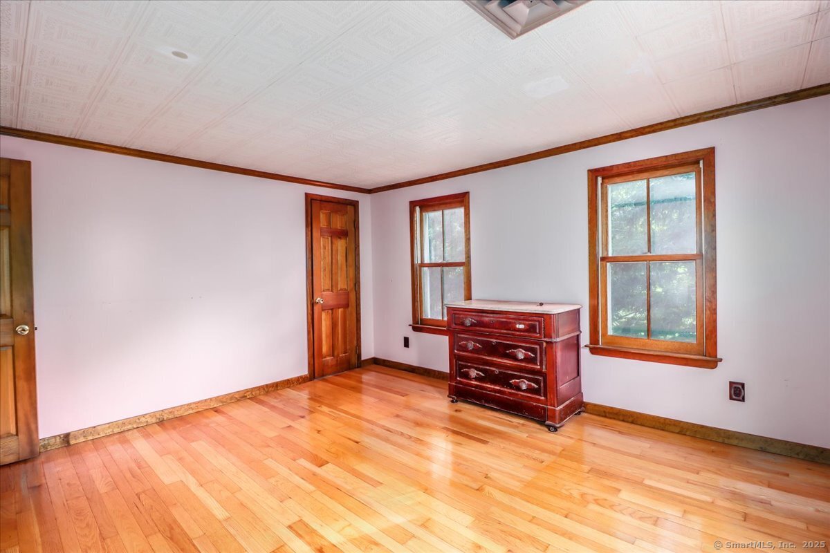 16 Farrell Road Newtown, CT 06470 - Photo 14 of 38 an empty room with furniture and windows