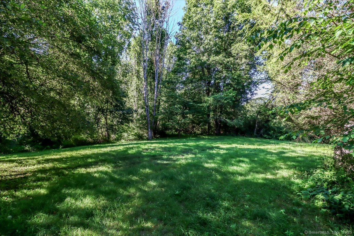 16 Farrell Road Newtown, CT 06470 - Photo 25 of 38 a view of a grassy field with trees