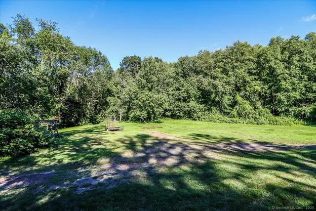 a house with trees in the background