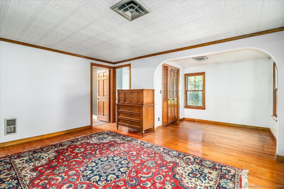 16 Farrell Road Newtown, CT 06470 - Photo 34 of 38 wooden floor in an empty room with a window