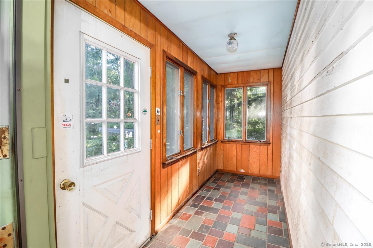 16 Farrell Road Newtown, CT 06470 - Photo 5 of 38 a view of a hallway with windows