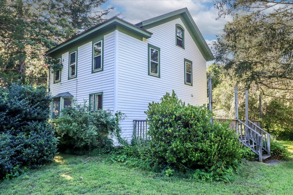 16 Farrell Road Newtown, CT 06470 - Photo 9 of 38 a view of a house with a yard and plants
