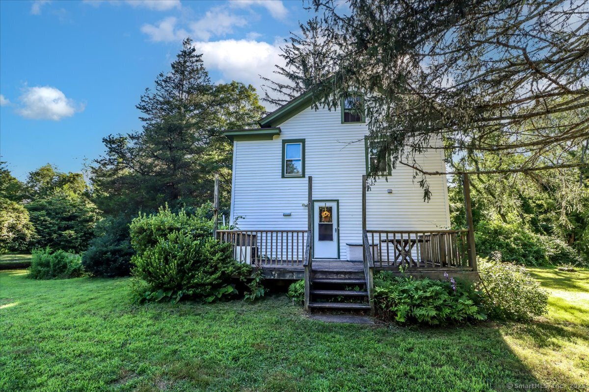 16 Farrell Road Newtown, CT 06470 - Photo 10 of 38 a view of backyard with garden and deck