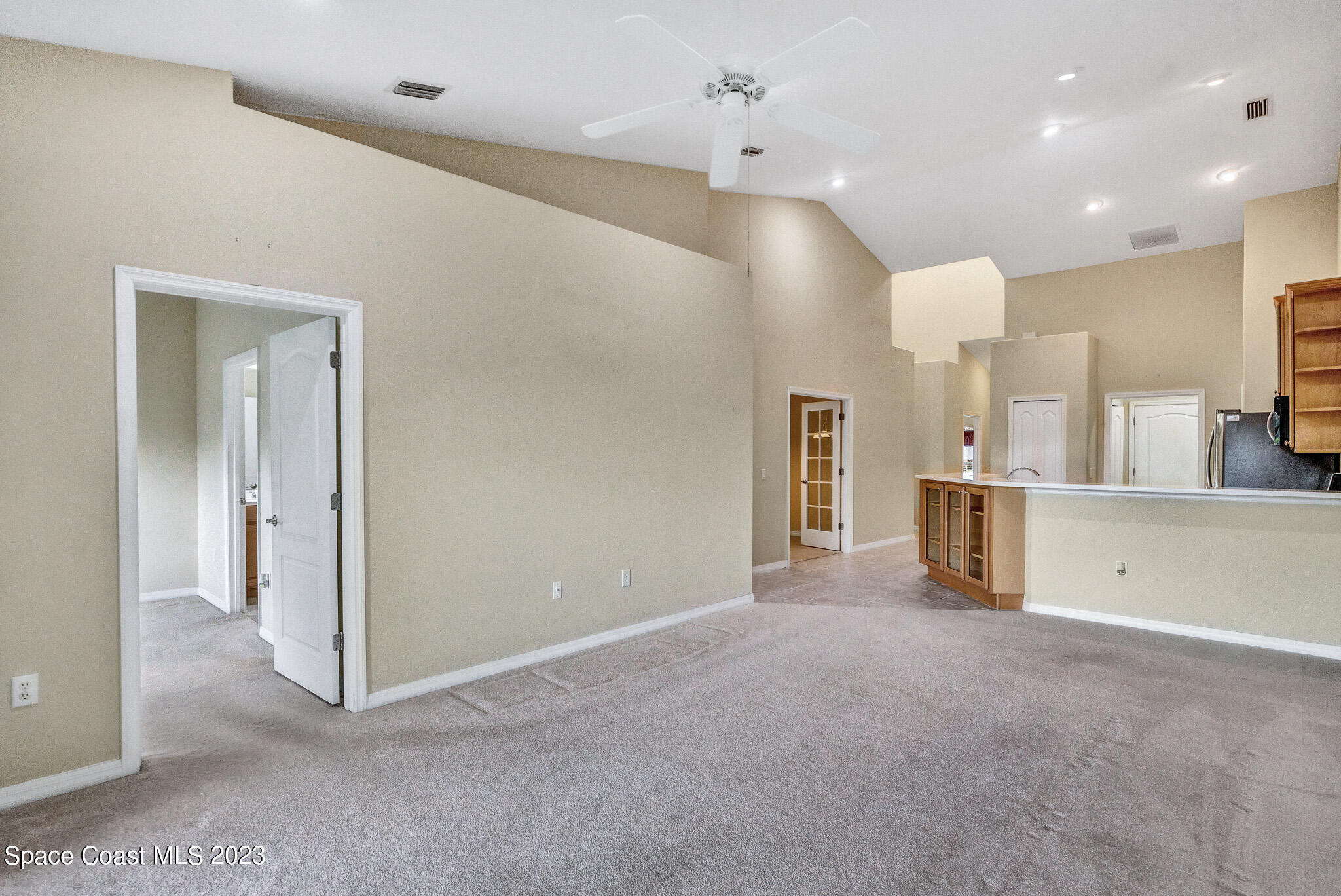 3071 Le Conte Street Melbourne, FL 32940 - Photo 13 of 41 a view of a kitchen with a sink and a refrigerator