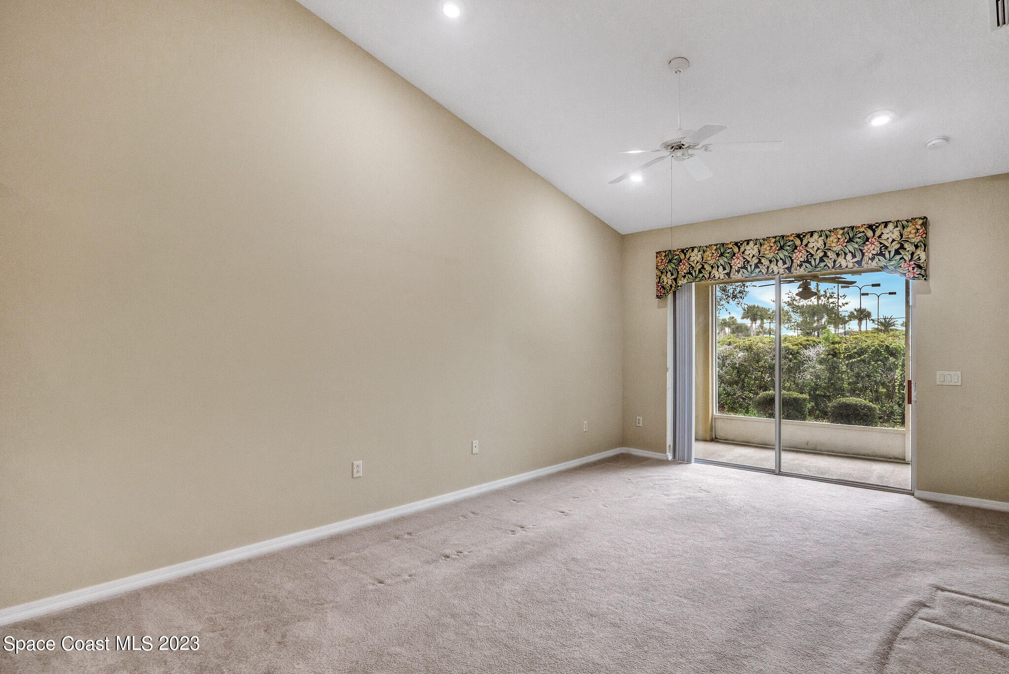 3071 Le Conte Street Melbourne, FL 32940 - Photo 15 of 41 a view of an empty room with wooden floor and a window