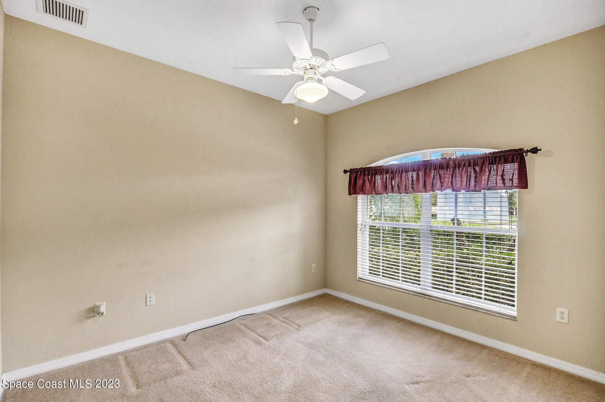 3071 Le Conte Street Melbourne, FL 32940 - Photo 16 of 41 a view of an empty room with a window
