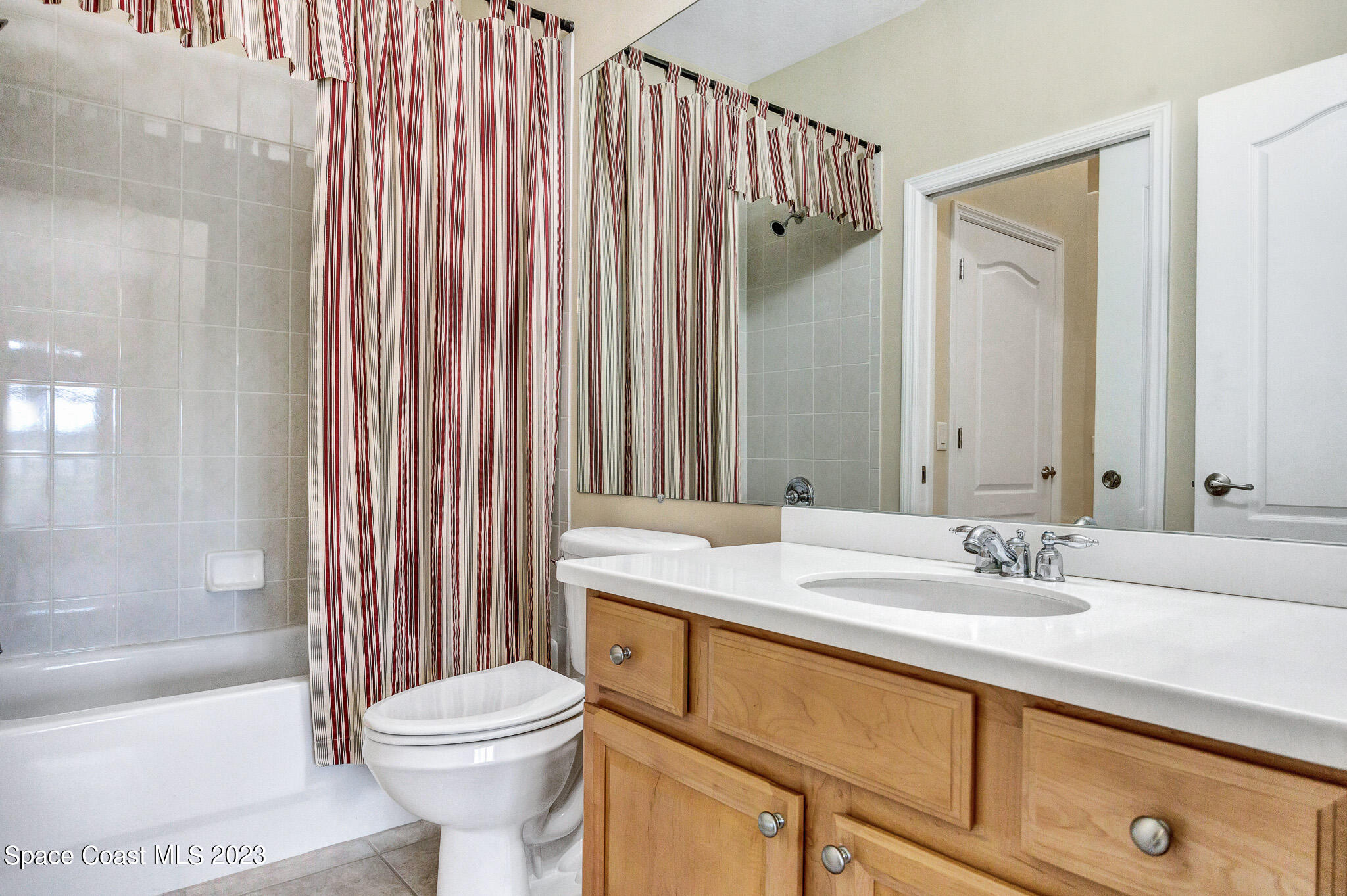3071 Le Conte Street Melbourne, FL 32940 - Photo 18 of 41 a bathroom with a sink a toilet and shower