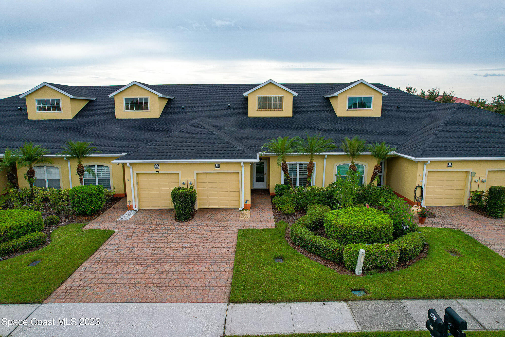 3071 Le Conte Street Melbourne, FL 32940 - Photo 26 of 41 a front view of a house with garden