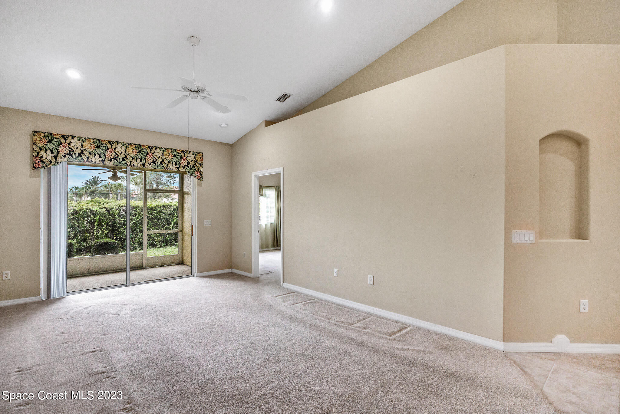 3071 Le Conte Street Melbourne, FL 32940 - Photo 31 of 41 a view of an empty room with wooden floor and a window