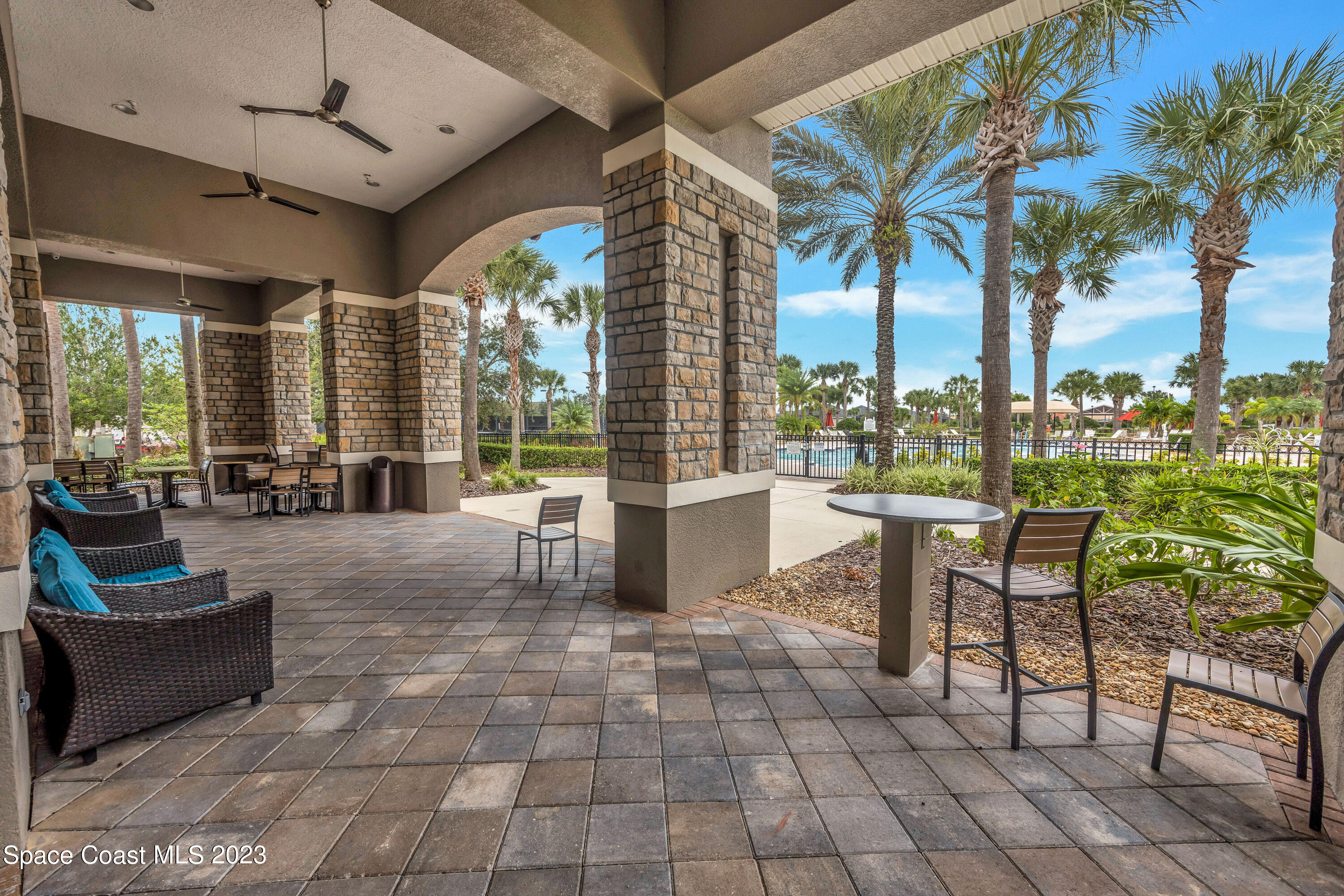 3071 Le Conte Street Melbourne, FL 32940 - Photo 38 of 41 a building outdoor space with patio furniture and a potted plant