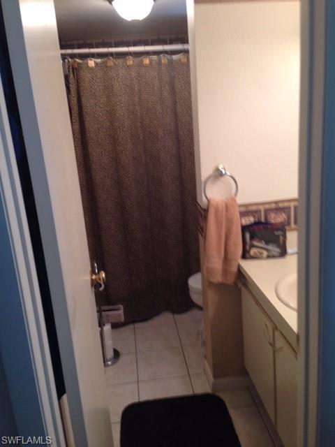 4338 27th Court Southwest, Unit 8201 Naples, FL 34116 - Photo 16 of 19 a bathroom with a sink and toilet