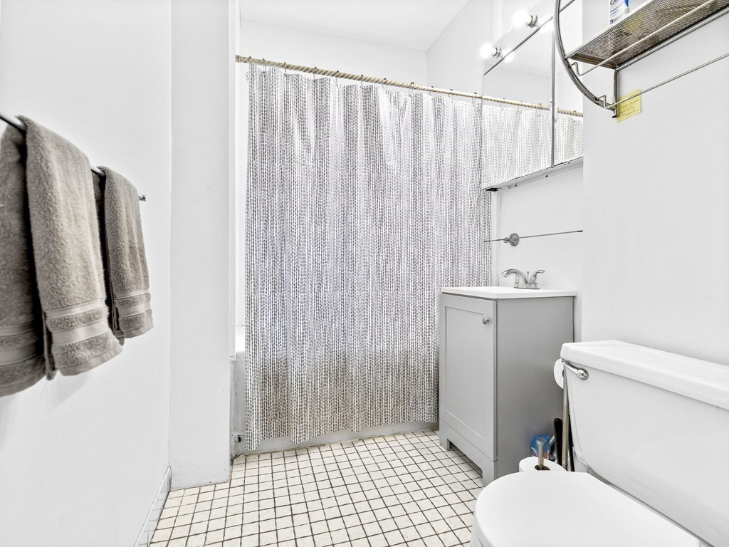 5 Spofford Road, Unit 8 Boston, MA 02134 - Photo 13 of 20 a bathroom with a sink toilet and shower
