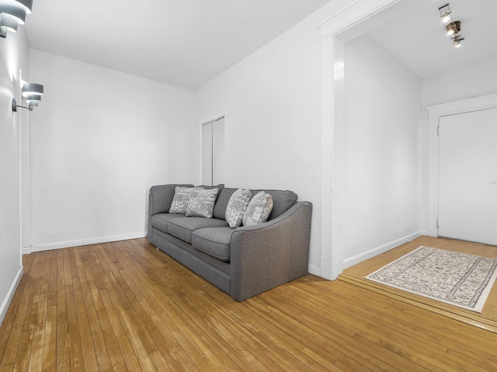 5 Spofford Road, Unit 8 Boston, MA 02134 - Photo 3 of 20 a living room with a couch and a rug