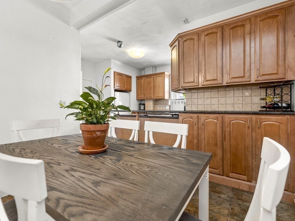 5 Spofford Road, Unit 8 Boston, MA 02134 - Photo 6 of 20 a kitchen with a stove a sink and a white cabinets