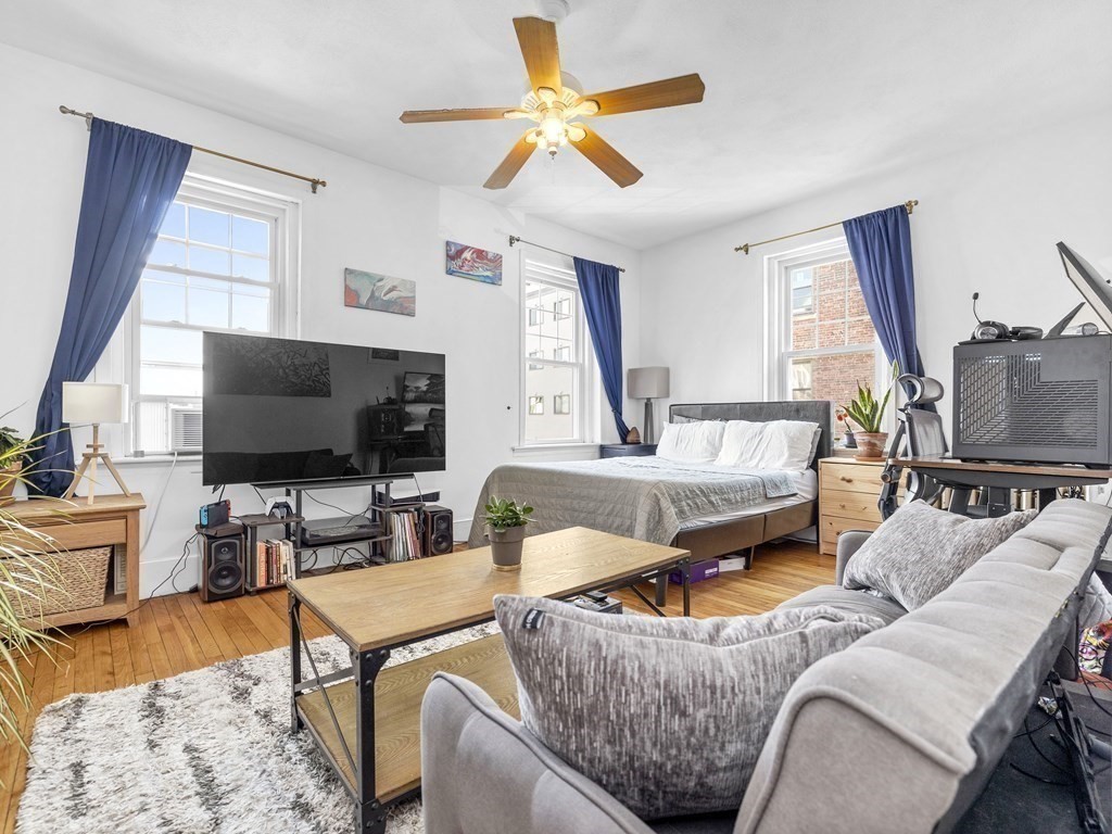5 Spofford Road, Unit 8 Boston, MA 02134 - Photo 8 of 20 a living room with furniture and a flat screen tv