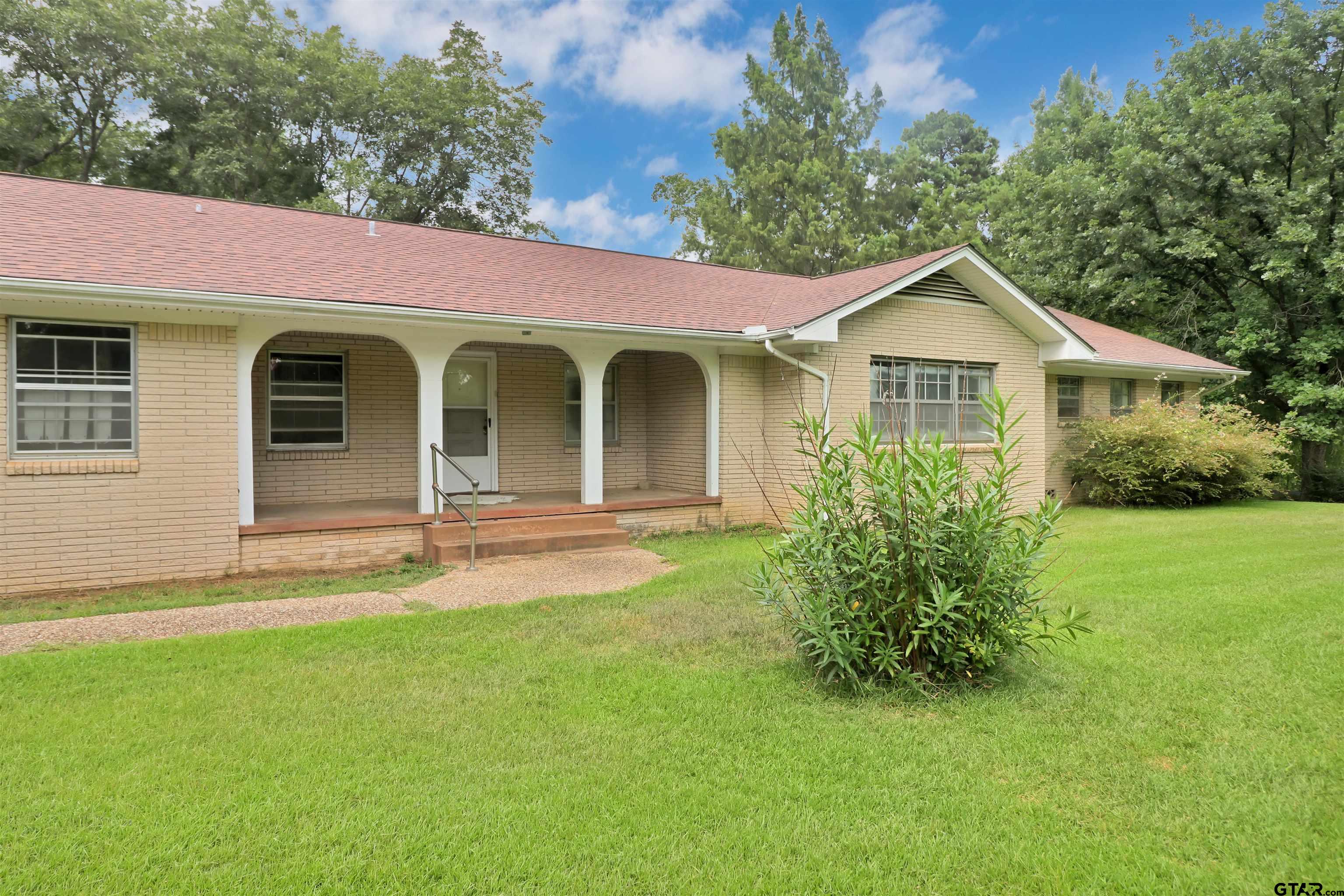 17645 East Us Highway Rusk, TX 75785 - Photo 5 of 31 a front view of a house with garden