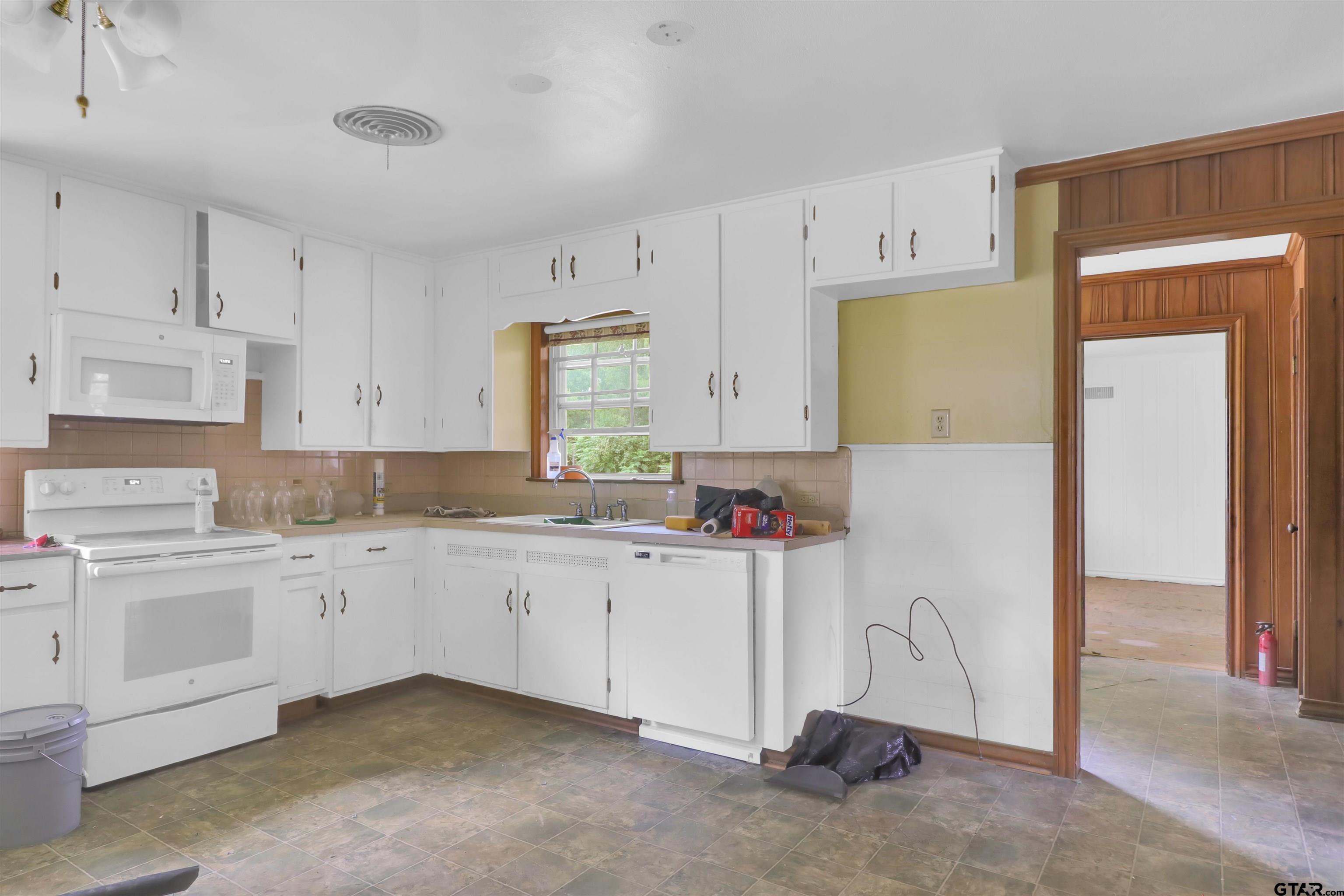 17645 East Us Highway Rusk, TX 75785 - Photo 9 of 31 a kitchen with cabinets and window
