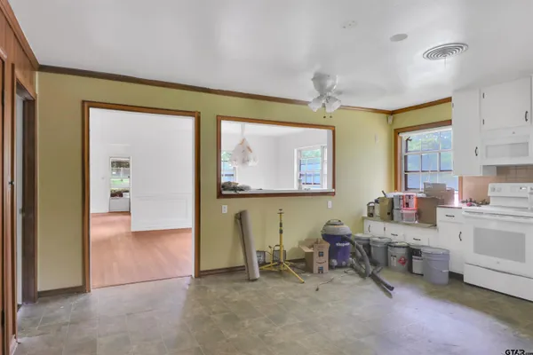 a view of a kitchen with wooden floor and a kitchen