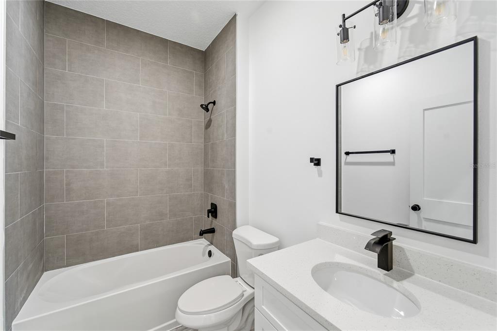 2773 Southwest 147st Street Road Ocala, FL 34473 - Photo 20 of 35 a bathroom with a sink a toilet and a bathtub