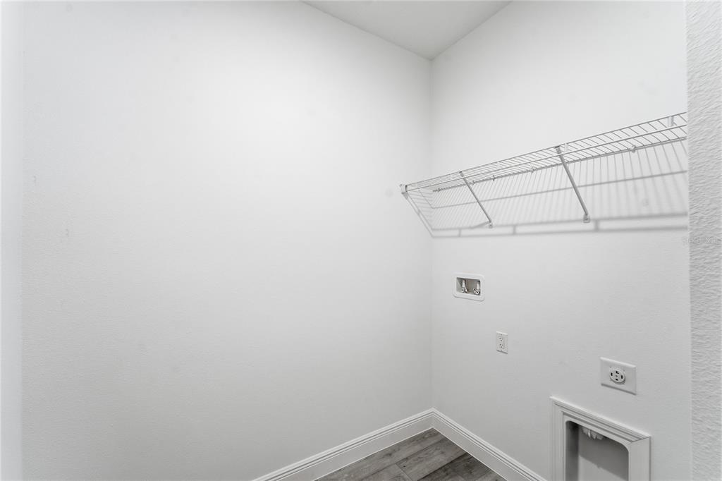 2773 Southwest 147st Street Road Ocala, FL 34473 - Photo 24 of 35 a view of a room with racks on the wall