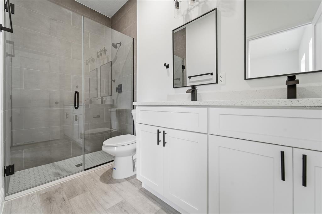 2773 Southwest 147st Street Road Ocala, FL 34473 - Photo 29 of 35 a bathroom with a toilet sink and shower