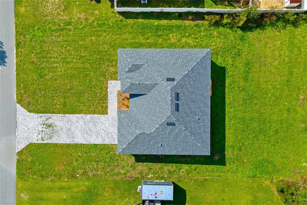 2773 Southwest 147st Street Road Ocala, FL 34473 - Photo 34 of 35 an aerial view of a house with a yard
