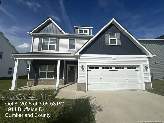 a front view of a house with a garage