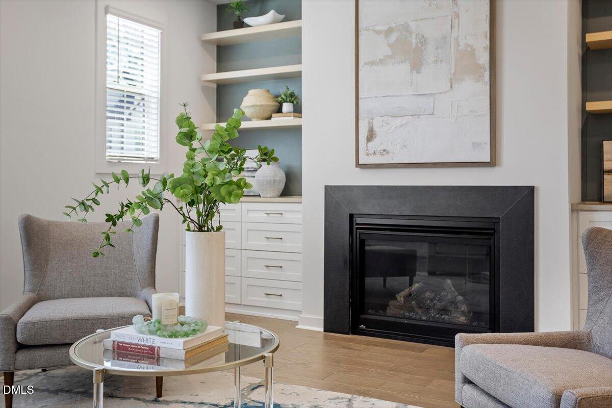 6419 Tanner Oak Lane Raleigh, NC 27613 - Photo 21 of 39 a living room with furniture and a fireplace