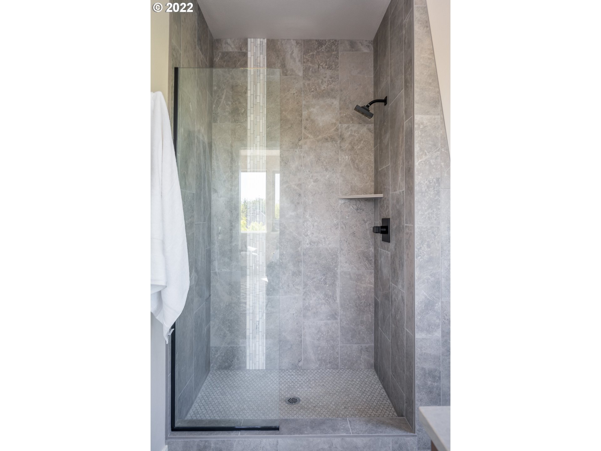 1175 Southeast Grant Street Portland, OR 97214 - Photo 20 of 32 a bathroom with a glass shower door