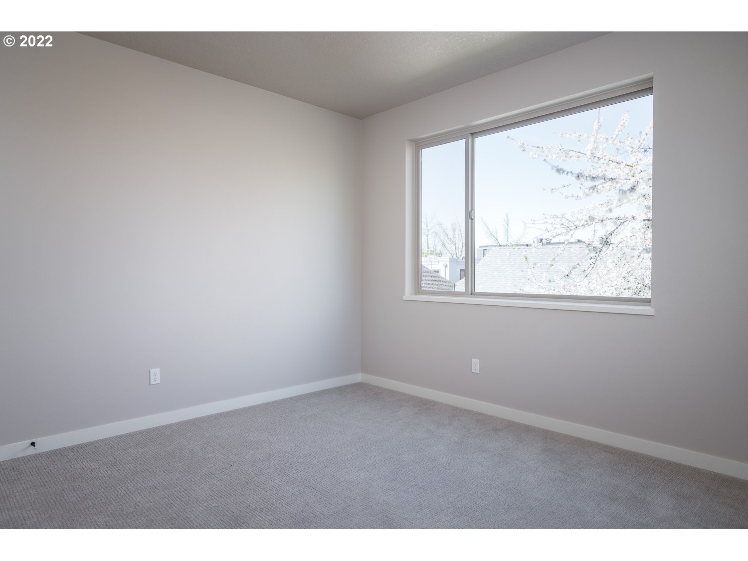 1175 Southeast Grant Street Portland, OR 97214 - Photo 28 of 32 a view of an empty room with a window