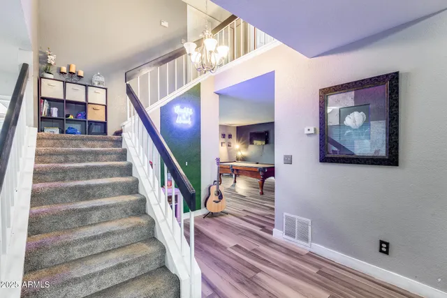 a bedroom with a bed and a table