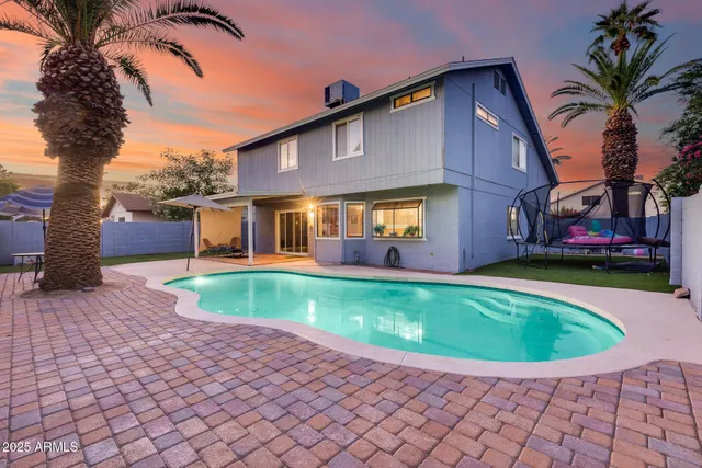 a room with furniture pool table and a fireplace