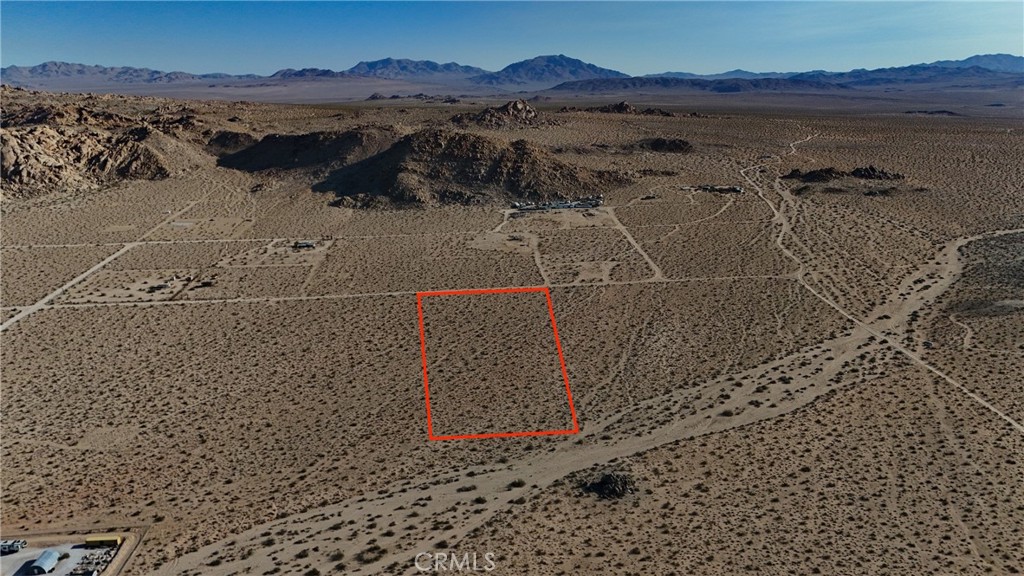 764 Rabbit Springs Road Lucerne Valley, CA 92356 - Photo 1 of 7 a view of a house with a mountain