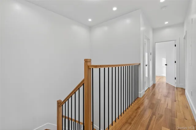 a bathroom with a granite countertop sink and white cabinets