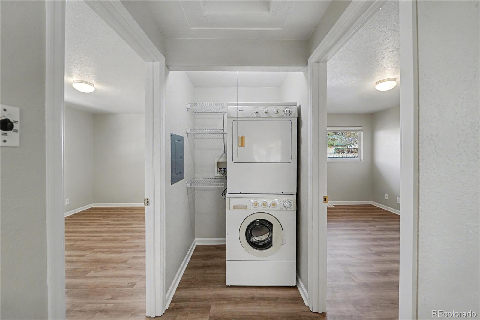 741 Emporia Street, Unit 741 Aurora, CO 80010 - Photo 5 of 11 a view of a storage & utility room with washer and dryer