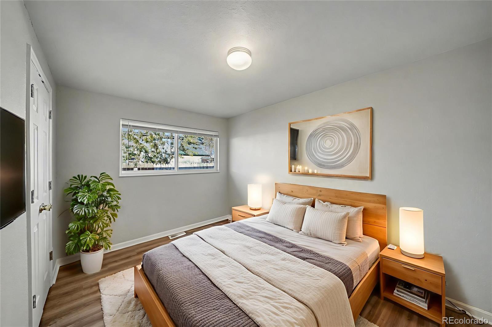 741 Emporia Street, Unit 741 Aurora, CO 80010 - Photo 6 of 11 a bedroom with a bed and a window