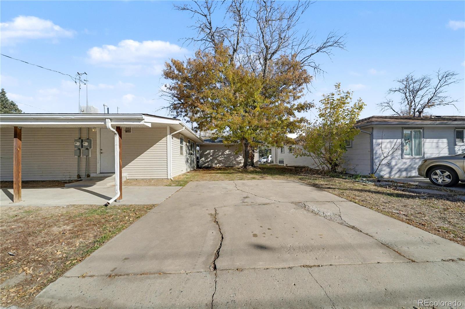741 Emporia Street, Unit 741 Aurora, CO 80010 - Photo 10 of 11 a house with trees in front of it
