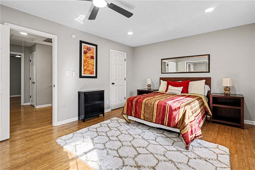 6052 WinterGreen Road Northwest Norcross, GA 30093 - Photo 11 of 24 a bedroom with a bed and a fireplace