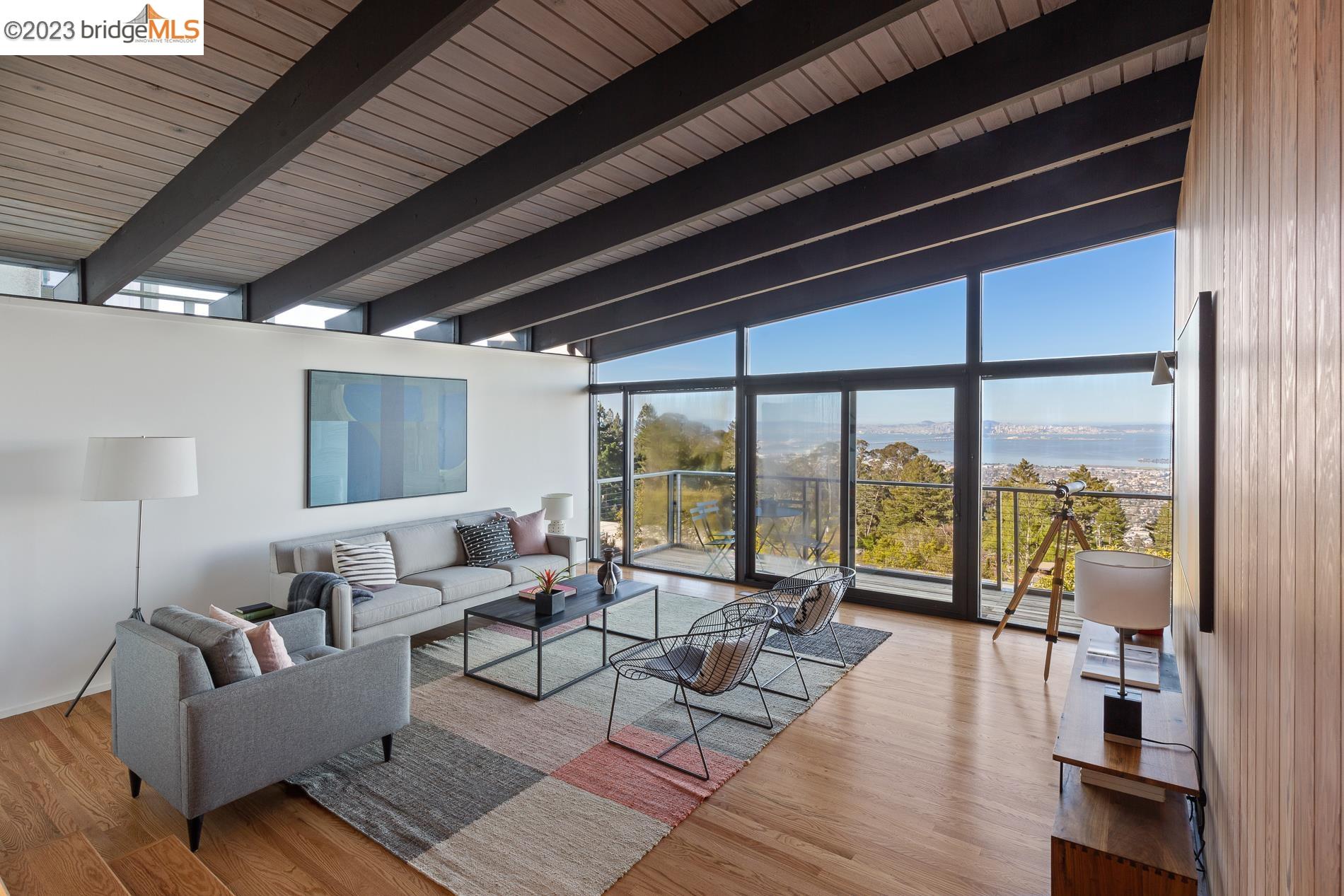 144 Hill Road Berkeley, CA 94708 - Photo 1 of 1 a living room with furniture and a large window