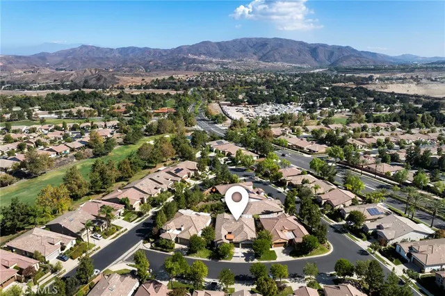 an aerial view of residential house and green space