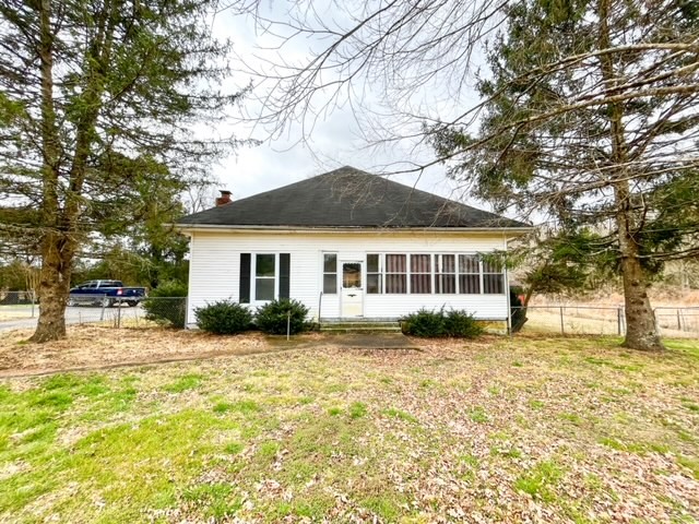 3576 Dog Branch Road Prospect, TN 38477 - Photo 1 of 24 a front view of a house with a yard