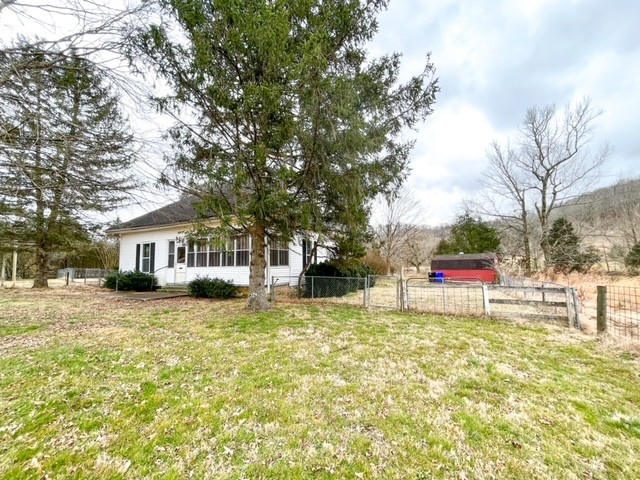 3576 Dog Branch Road Prospect, TN 38477 - Photo 23 of 24 a house that has a tree in front of the house