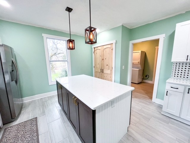 3576 Dog Branch Road Prospect, TN 38477 - Photo 4 of 24 a kitchen with stainless steel appliances granite countertop a refrigerator a sink dishwasher a stove and white countertops with wooden floor