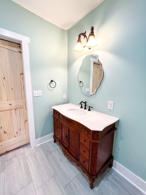 3576 Dog Branch Road Prospect, TN 38477 - Photo 8 of 24 a bathroom with a sink vanity and a mirror