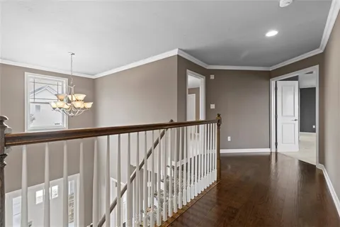 a view of staircase with wooden floor