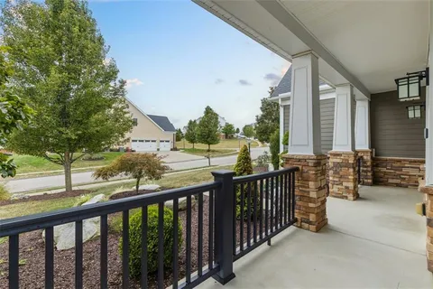 a view of a balcony with chairs
