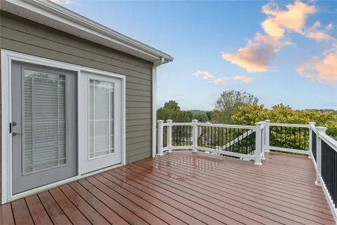 a terrace with wooden floor and fence