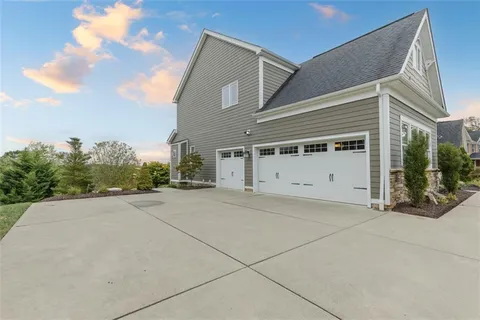 a view of a house with garage and window