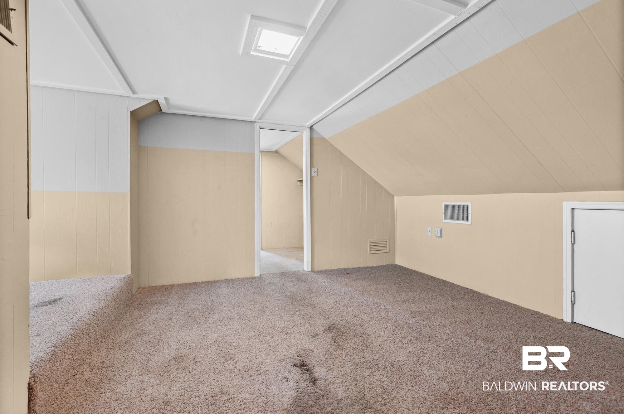 5510 Richmond Road Mobile, AL 36608 - Photo 18 of 21 Carpeted room with sloped ceilings and a skylight